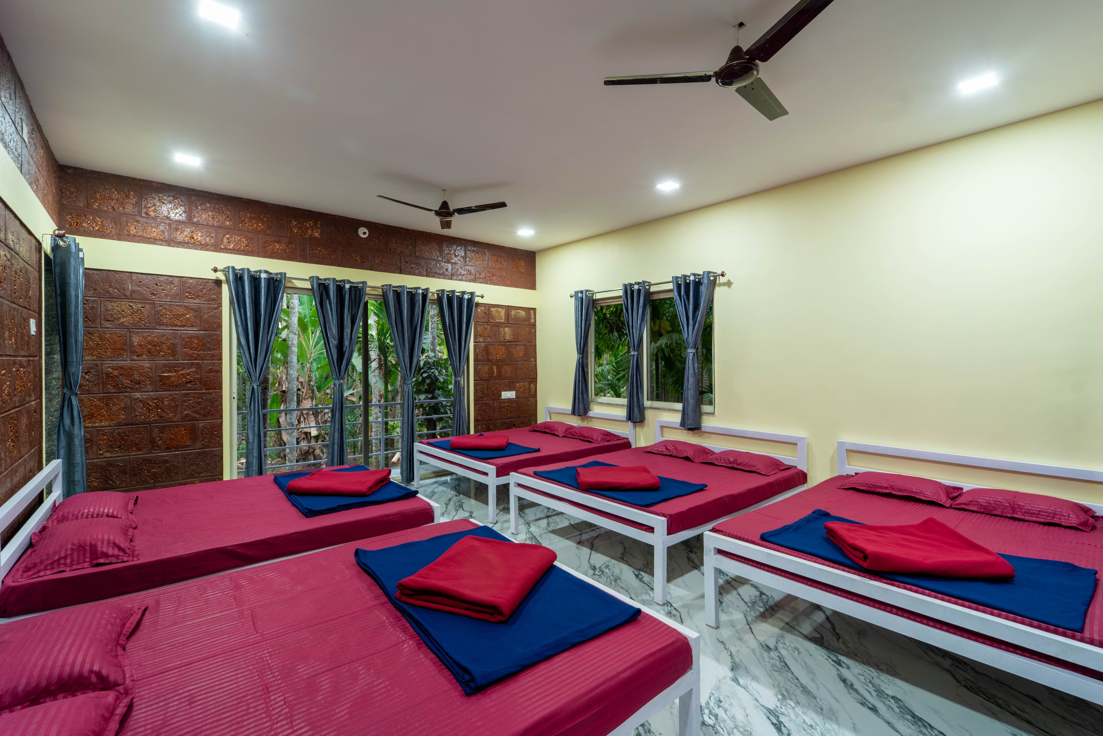 Spacious 10-bed dormitory room at Infinity Junglestay, Dandeli