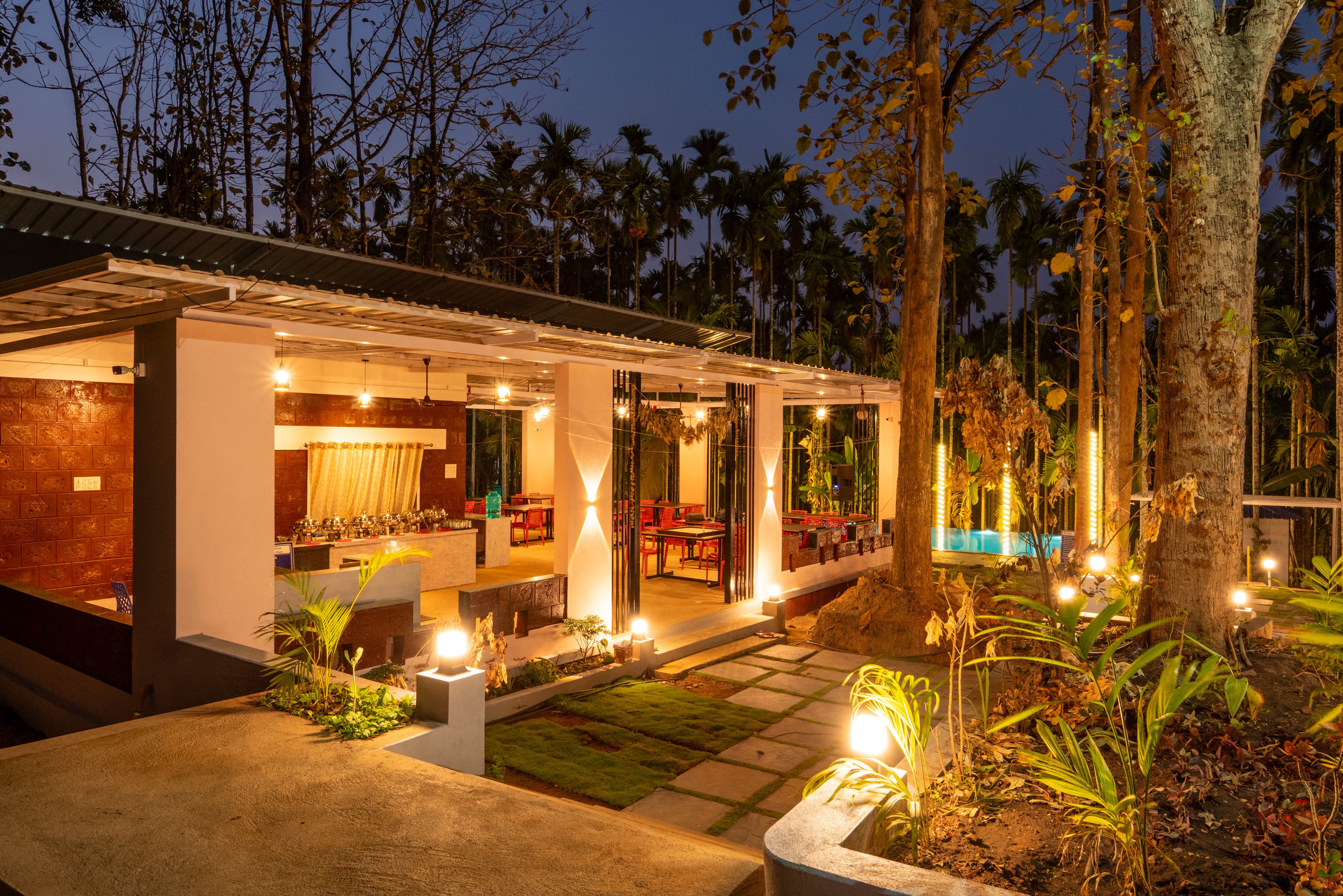 Night view of the dining hall at Infinity Junglestay