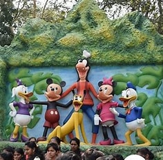 A family enjoying rides and activities at a local amusement park in Dandeli